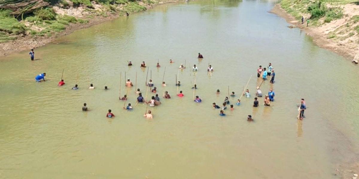 ধলাই নদীতে শত বছরের পলো বাওয়া উৎসব